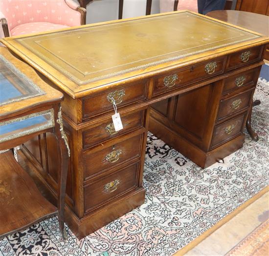 A Georgian style oak pedestal desk W.130cm